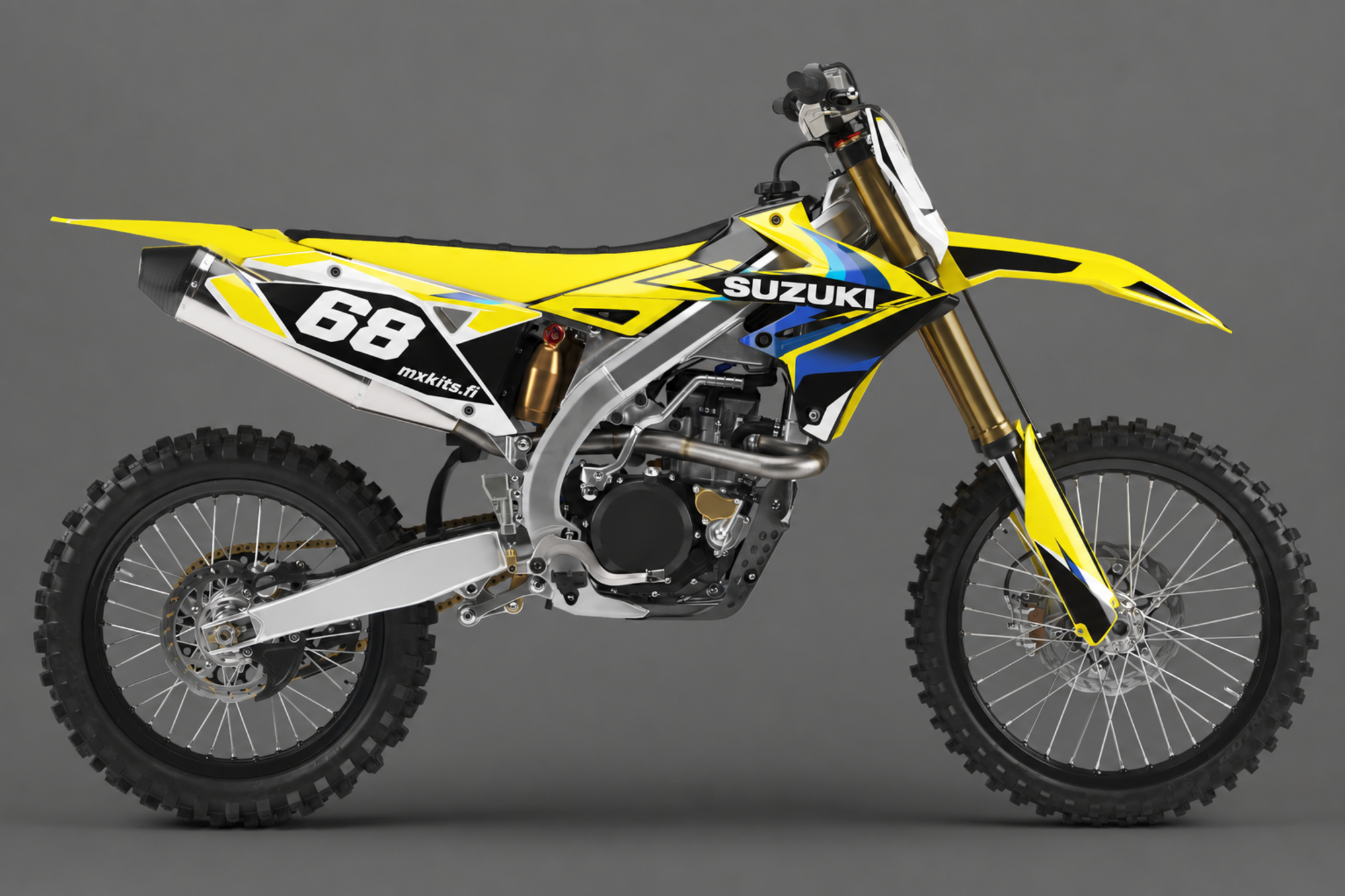 Keltainen, valkoinen, musta ja sininen Suzuki-motocrosspyörä Eighty Two -grafiikalla, numero 68, SUZUKI ja mxkits.fi.